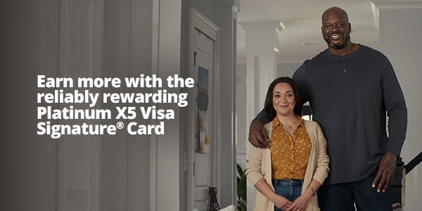 Shaq and a housewife standing together in her living room