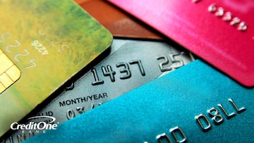 A close-up view of a stack of miscellaneous credit cards represents potentially using one credit card to pay off another.