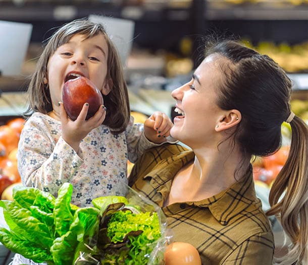 Mother and child grocery shopping