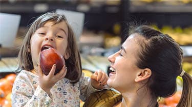 Mother and child grocery shopping